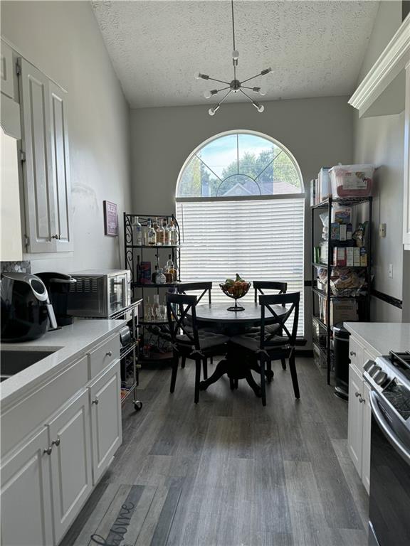 4209 Reeshemah Street Atlanta, GA 30349 - Photo 3 of 12 a view of a dining room with furniture window and wooden floor