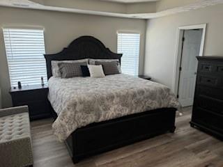 4209 Reeshemah Street Atlanta, GA 30349 - Photo 6 of 12 a bed sitting in a bedroom next to a window with dresser