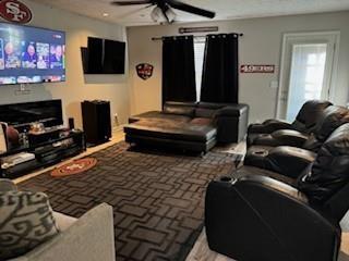 4209 Reeshemah Street Atlanta, GA 30349 - Photo 10 of 12 a living room with furniture and a flat screen tv