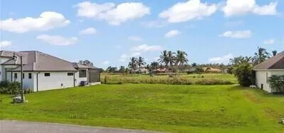 a view of an house with backyard space and garden