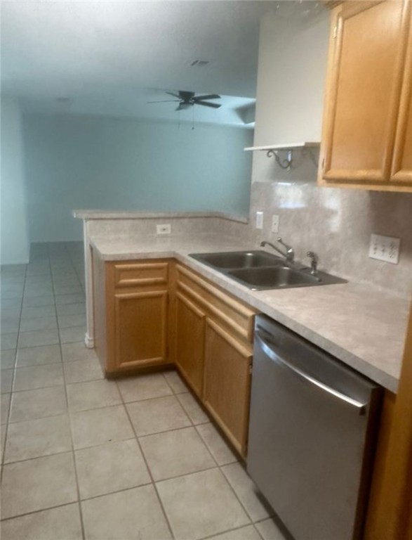 15618 Cruiser Street Corpus Christi, TX 78418 - Photo 3 of 14 a kitchen with a sink a stove cabinets and utility room
