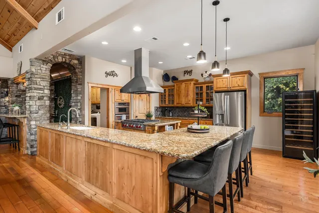 a kitchen with a table and chairs in it
