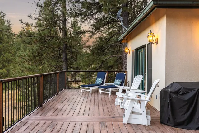 a view of balcony with furniture and wooden floor