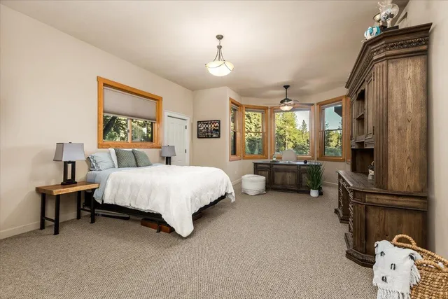 a bed room with a bed and a window