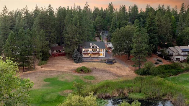 a view of a chairs and table in the garden