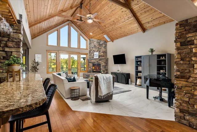 a living room with fireplace furniture and a flat screen tv