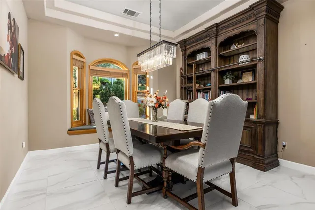 a dining room with furniture and window
