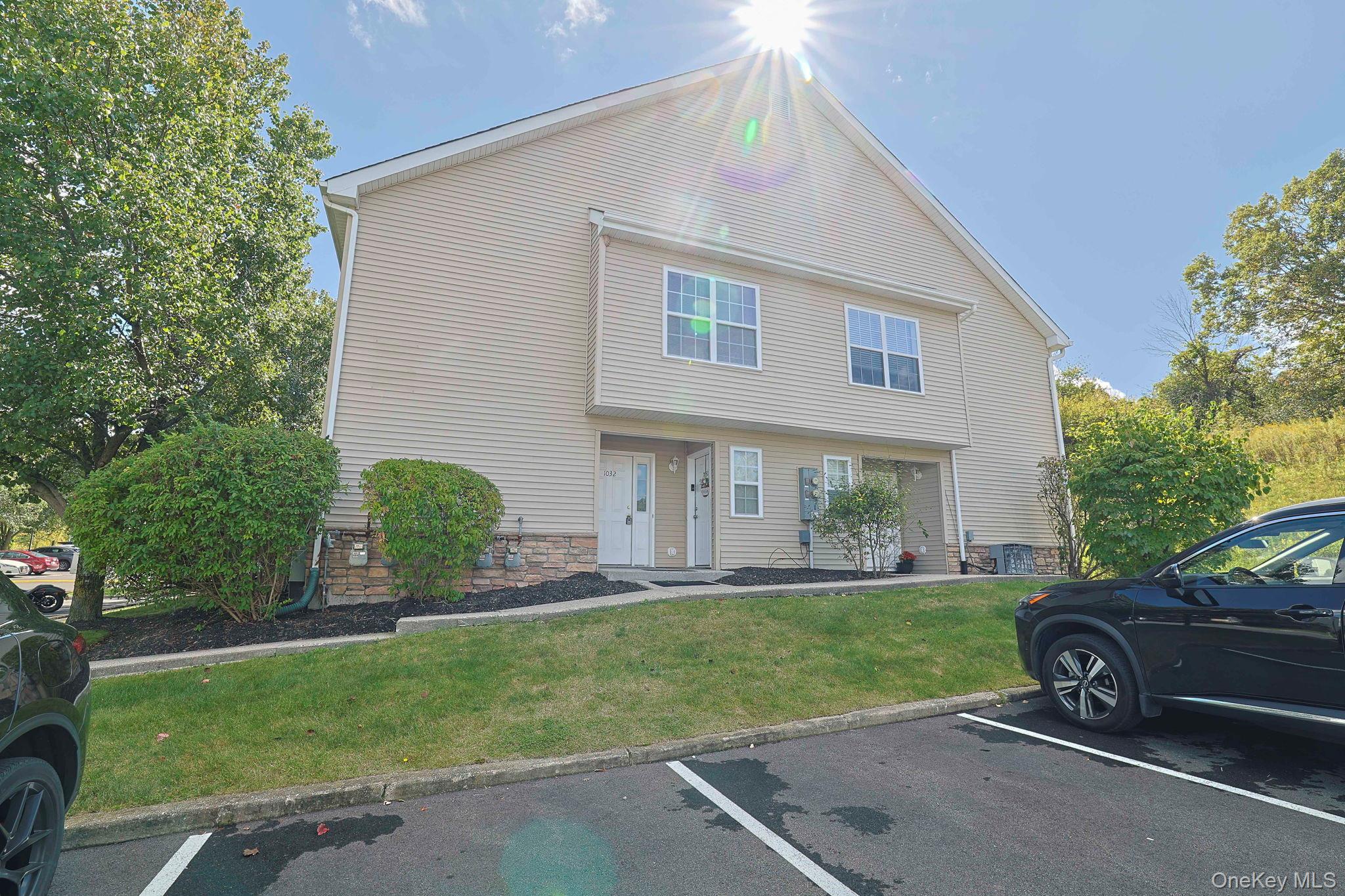 1026 Maggie Road, Unit 1411 Newburgh, NY 12550 - Photo 1 of 1 a view of a house with a backyard