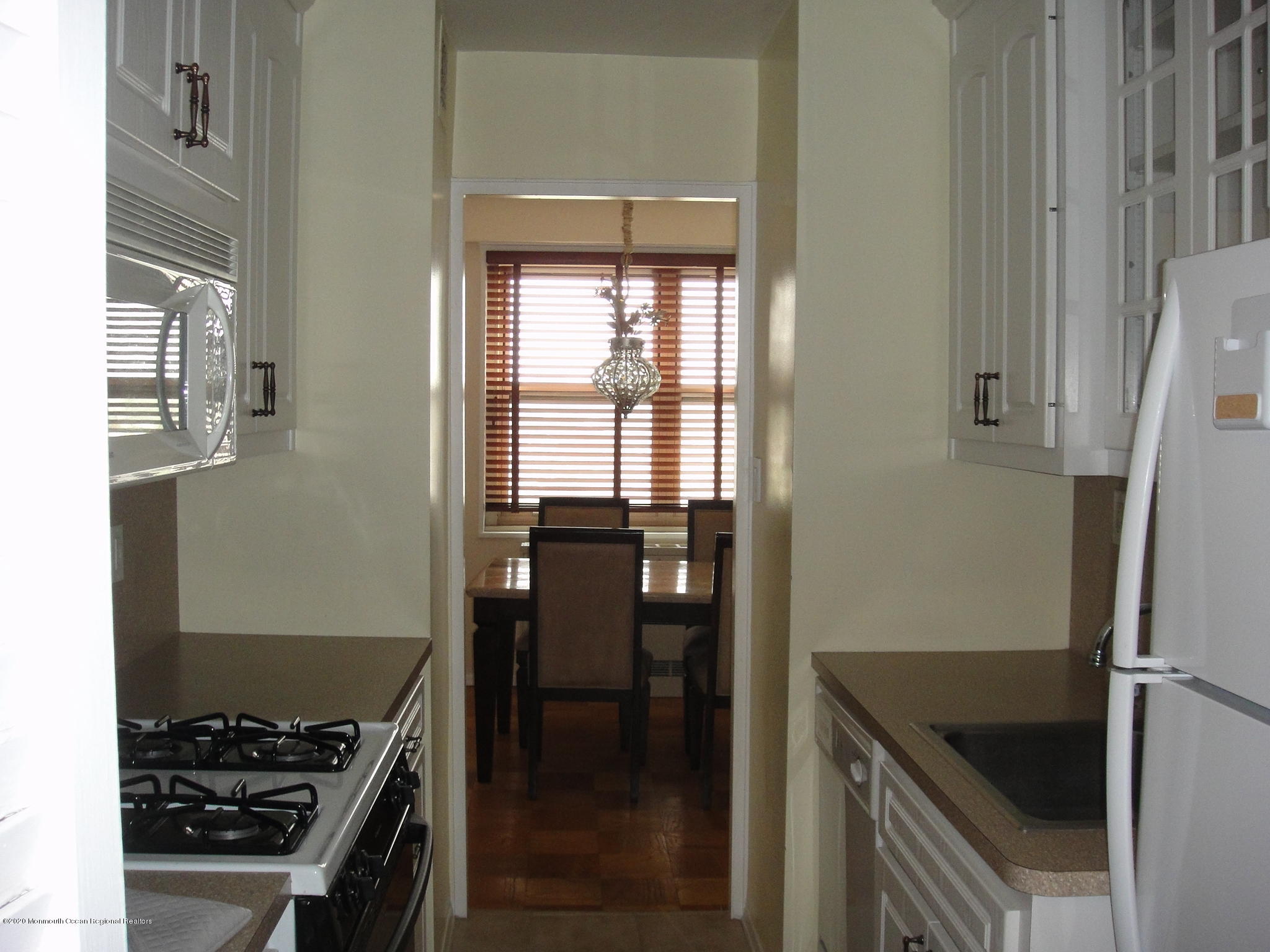 28 Riverside Avenue, Unit 9C Red Bank, NJ 07701 - Photo 5 of 21 Kitchen Opens to Dining Room