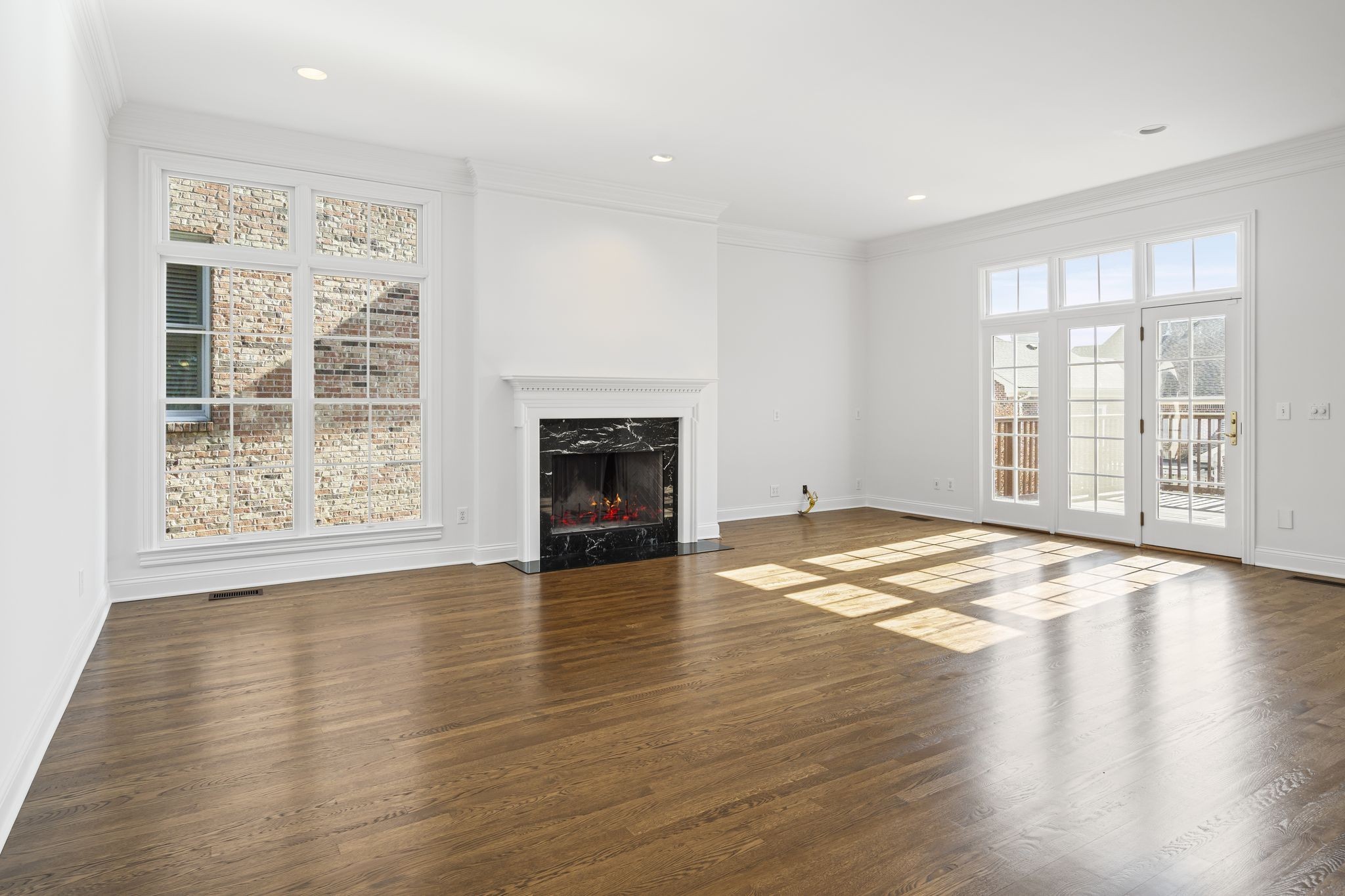 46 Green View Nashville, TN 37205 - Photo 14 of 46 an empty room with wooden floor fireplace and windows