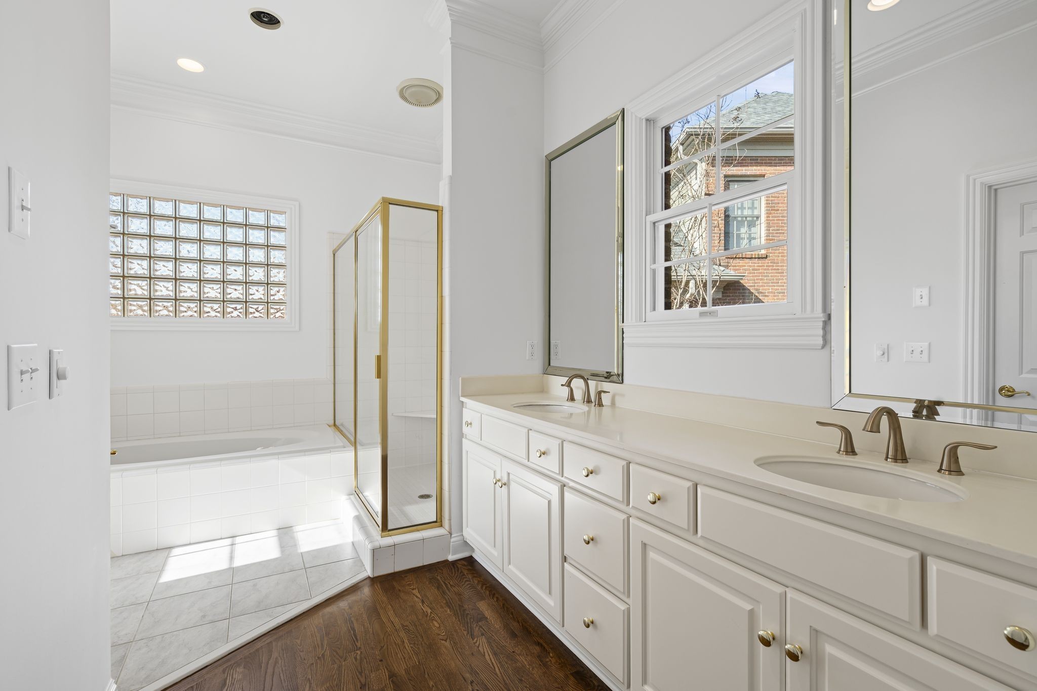 46 Green View Nashville, TN 37205 - Photo 18 of 46 a bathroom with a double vanity sink a mirror and a bathtub