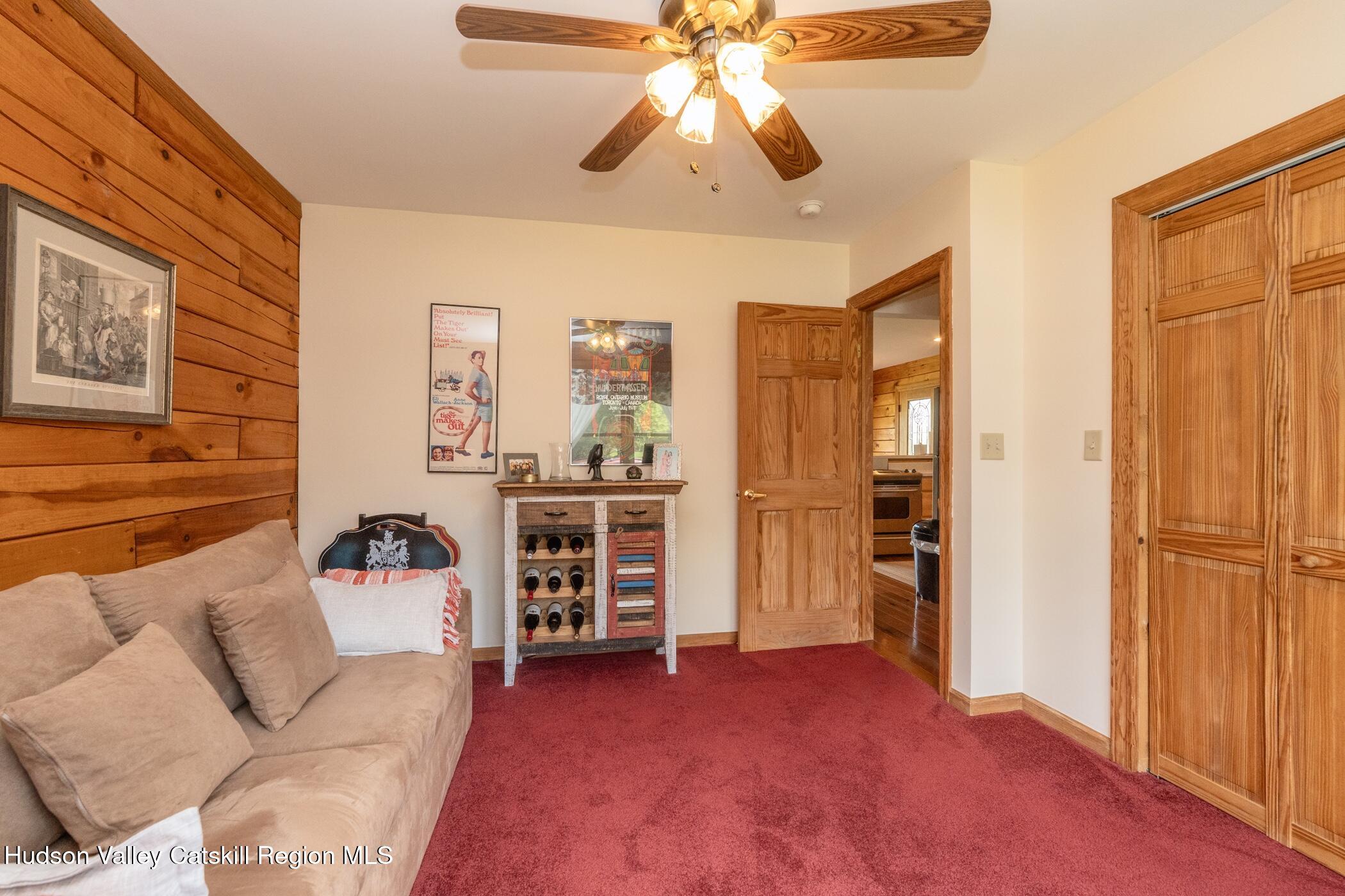140 Stone Dock Road High Falls, NY 12440 - Photo 16 of 42 a living room with furniture and a chandelier