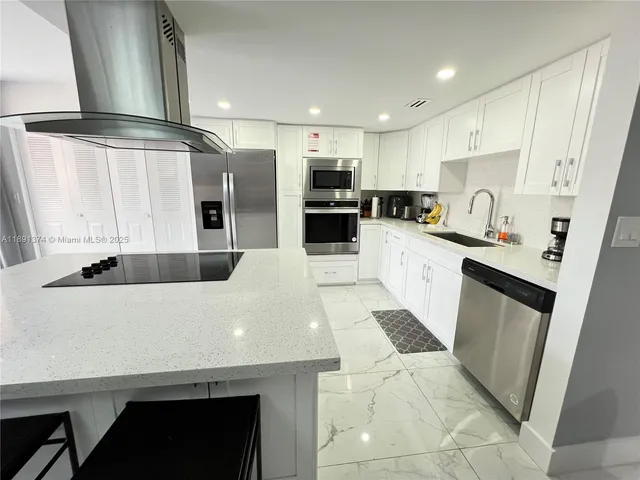 a kitchen with a stove and a microwave