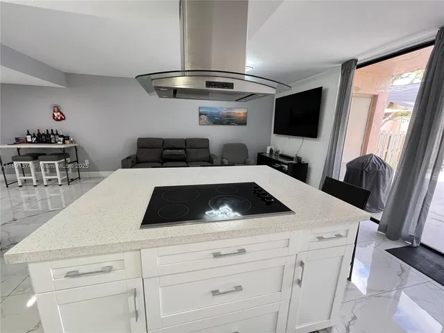 a kitchen with a table and chairs in it