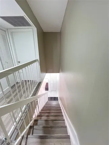 a bedroom with a bed and a mirror