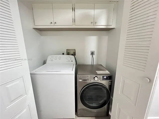 a spacious bedroom with a bed and wooden floor