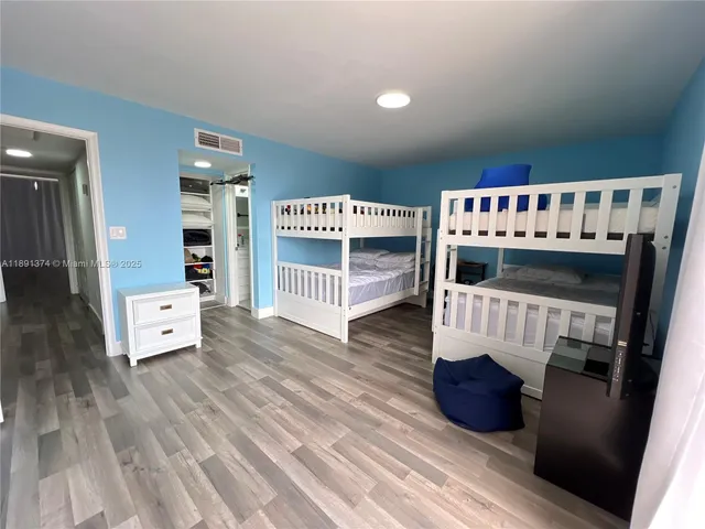 a view of a patio with a table and chairs