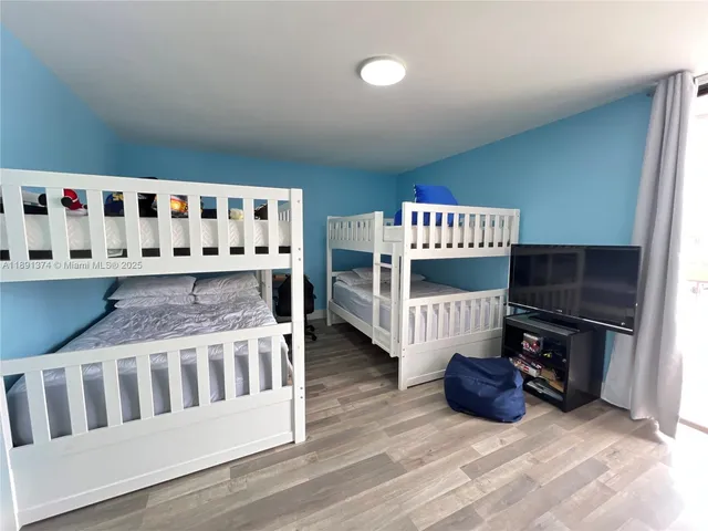 a view of a patio with a table and chairs