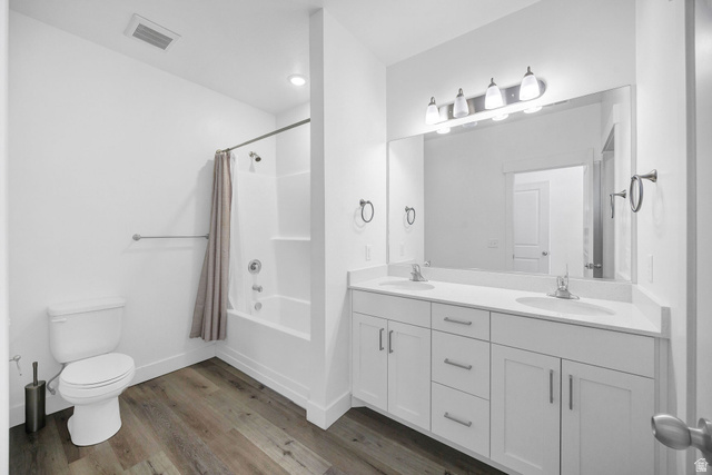 3115 South 200 West, Unit C201 Nibley, UT 84321 - Photo 9 of 23 Bathroom featuring a dual vanity with white cabinetry, integrated sinks, and a large wall-mounted mirror
