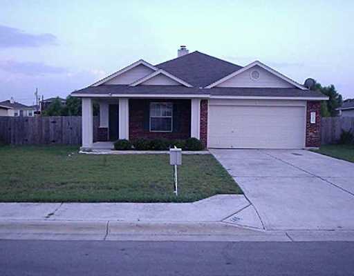 145 Spring Branch Loop Kyle, TX 78640 - Photo 1 of 1 a front view of a house with a yard and garage