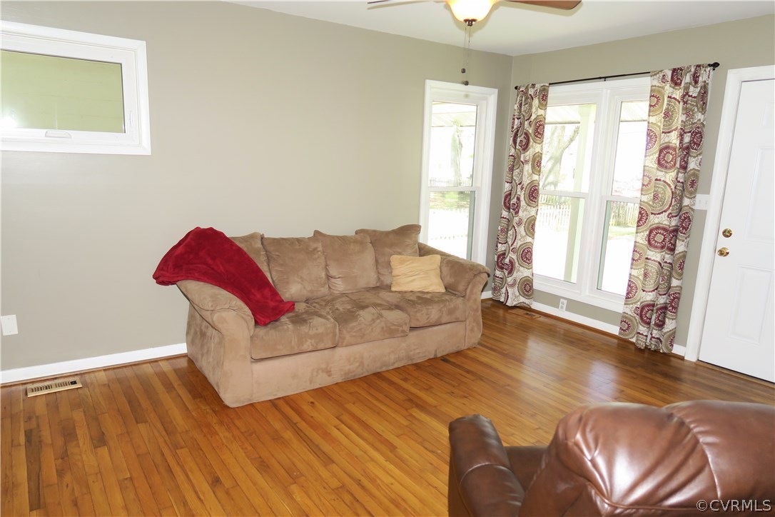 14400 Rivermont Road Chester, VA 23836 - Photo 4 of 15 a living room with furniture and a wooden floor