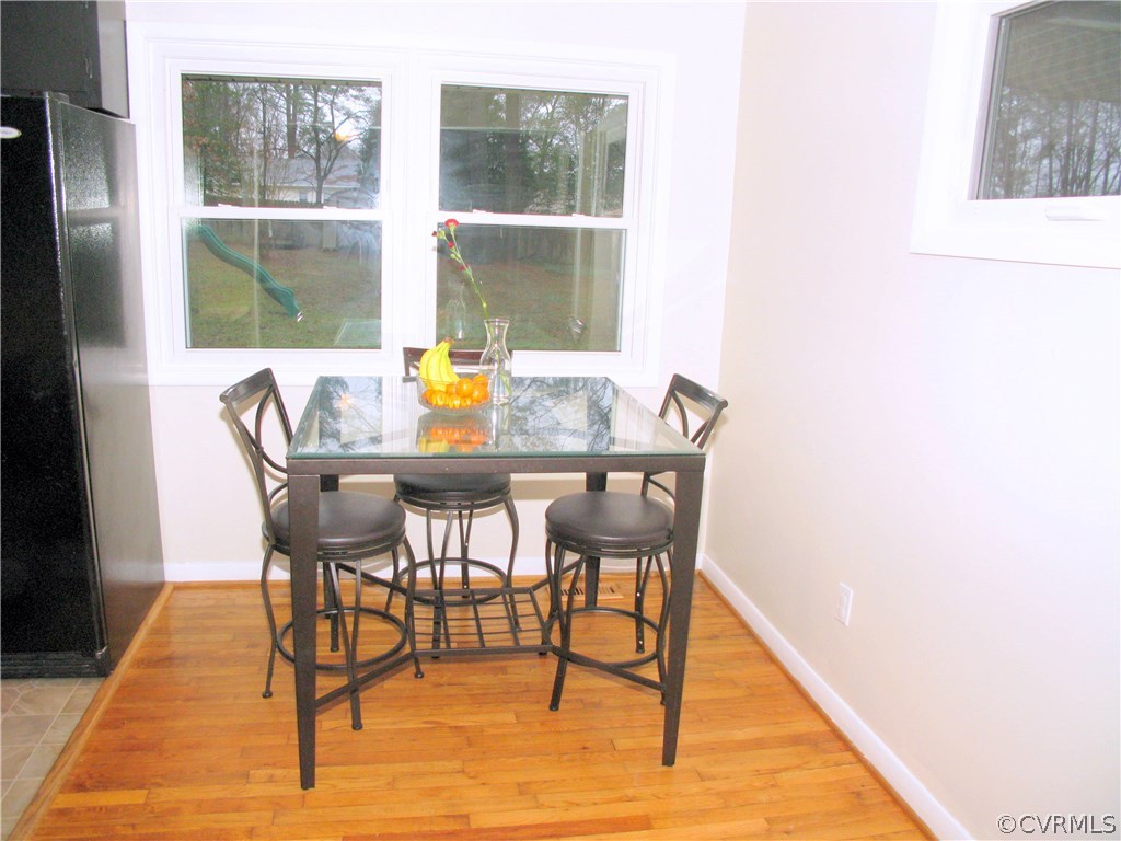 14400 Rivermont Road Chester, VA 23836 - Photo 8 of 15 a view of a dining room with furniture and wooden floor