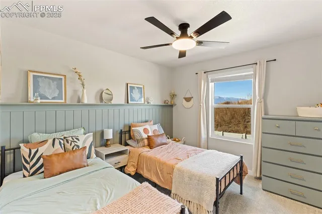 a bedroom with a large bed and a window