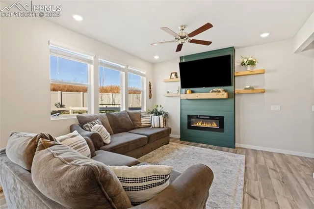 a living room with furniture fireplace and a flat screen tv