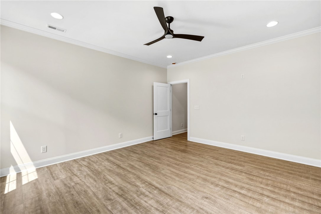 1735 Maw Bridge Road Central, SC 29630 - Photo 18 of 38 This spacious room features elegant crown molding and durable wood flooring.