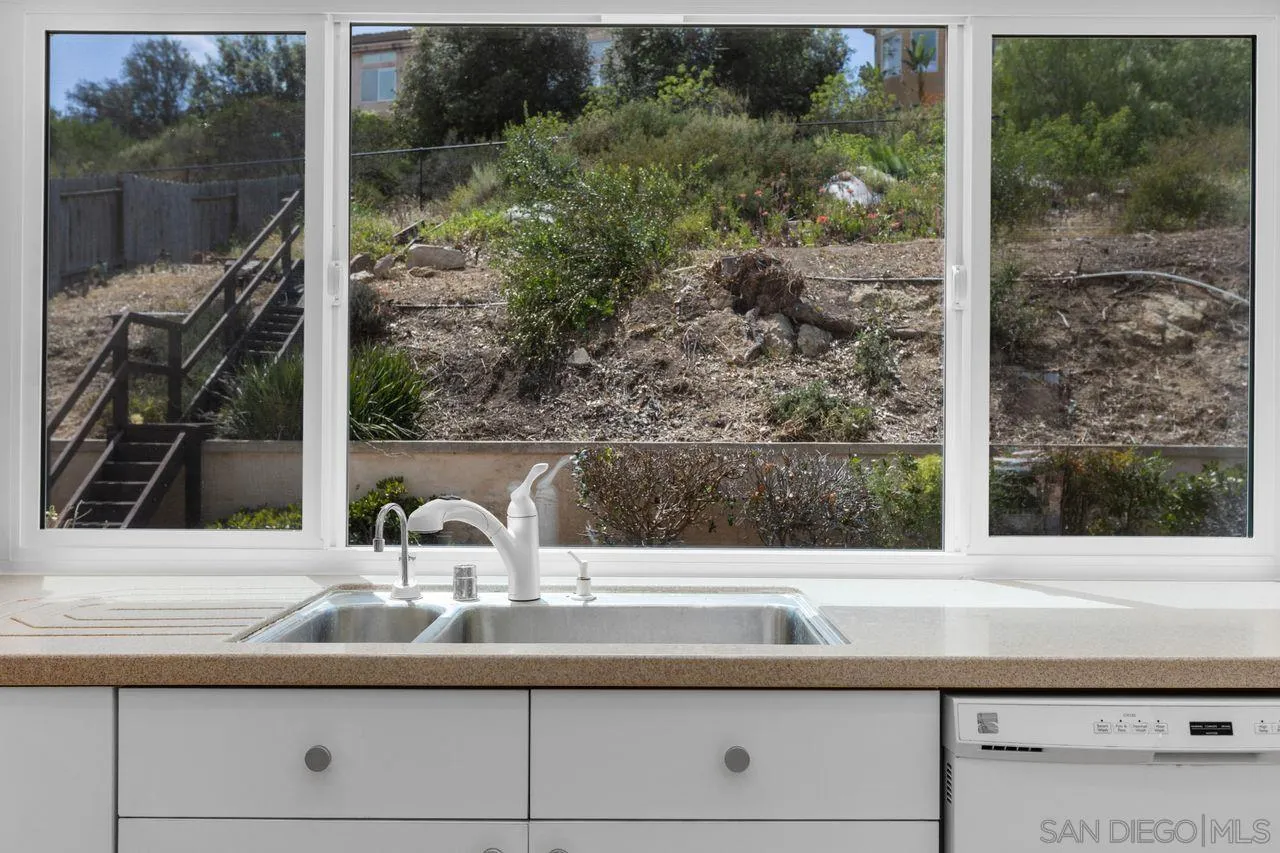 17054 Matinal Road San Diego, CA 92127 - Photo 18 of 50 a bathroom sink with a mirror