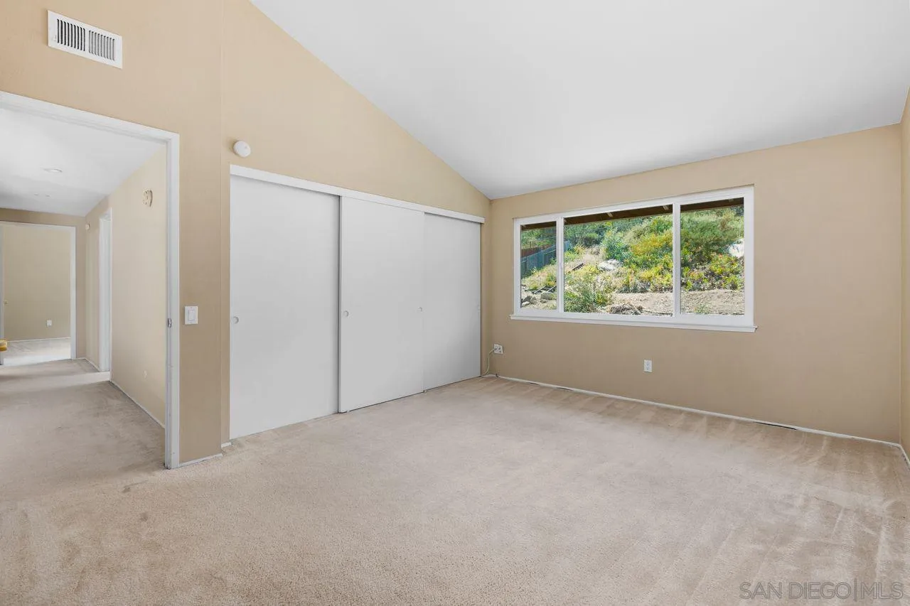 17054 Matinal Road San Diego, CA 92127 - Photo 29 of 50 an empty room with windows