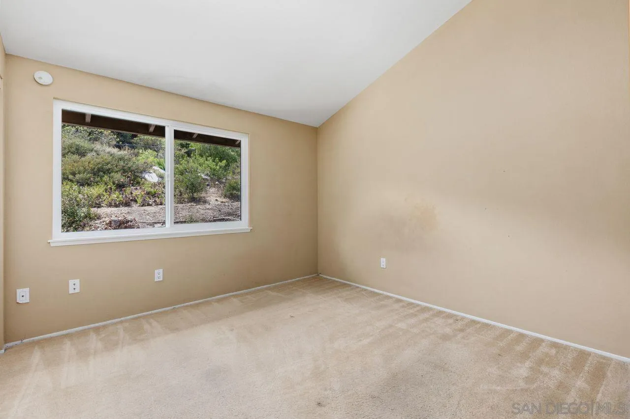 17054 Matinal Road San Diego, CA 92127 - Photo 31 of 50 an empty room with windows and closet