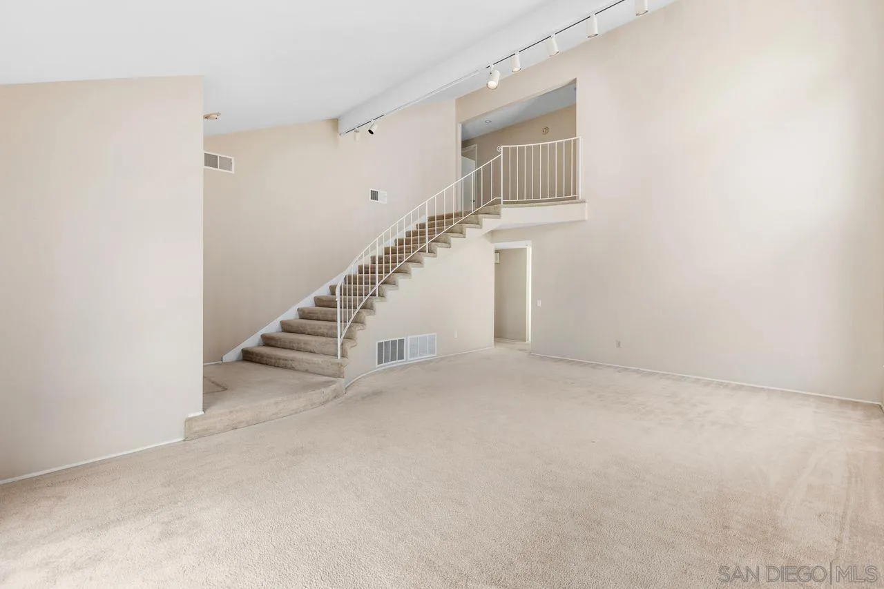 17054 Matinal Road San Diego, CA 92127 - Photo 5 of 50 a view of an empty room with stairs