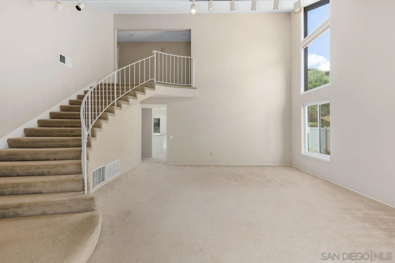 17054 Matinal Road San Diego, CA 92127 - Photo 7 of 50 a view of staircase with white walls and windows