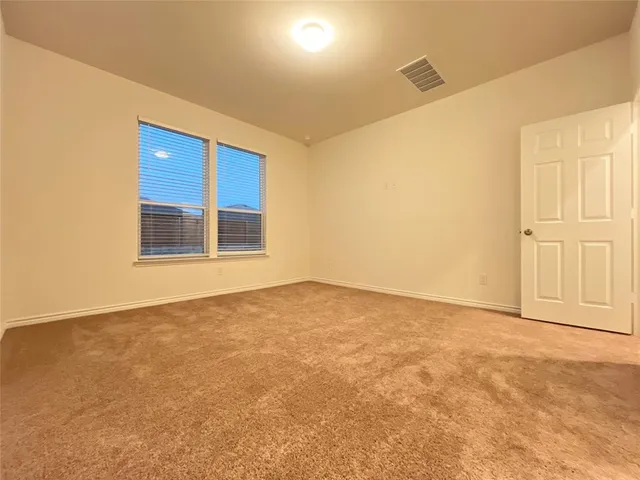 a view of an empty room with window