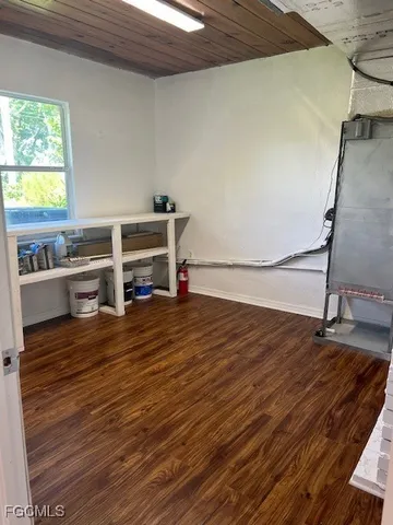 a view of a room with wooden floor and chair