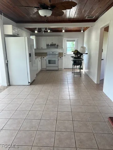 a kitchen with a sink and a stove top oven