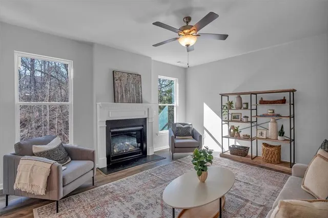 a living room with furniture and a fireplace