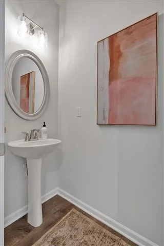a bathroom with a sink a mirror and vanity