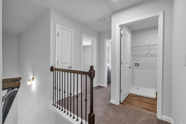 a view of a hallway with closet area