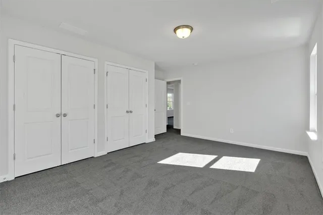 a view of an empty room with windows