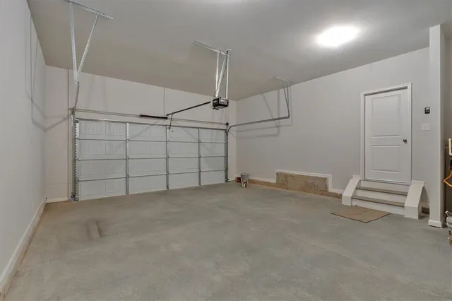 an empty room with projector & cabinets