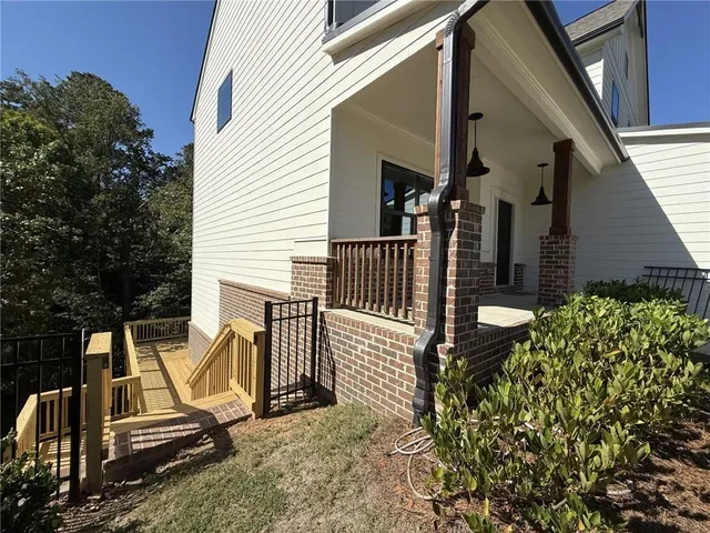 a view of balcony with wooden floor and outdoor seating