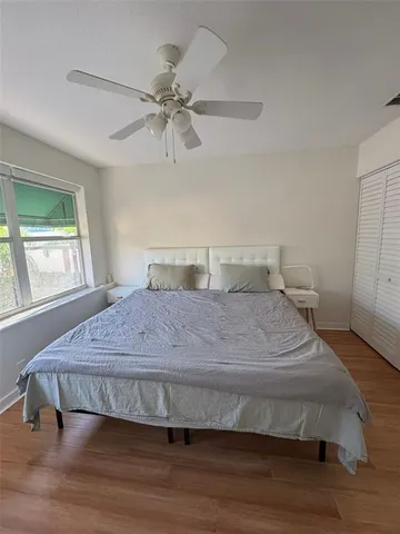 a bedroom with a bed and window