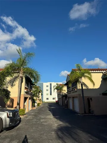 an outdoor space with furniture and garden