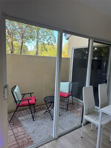 a view of a room with furniture and a window