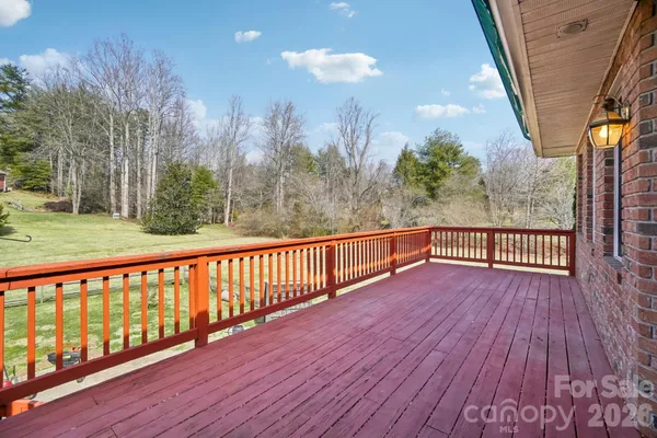 a view of balcony with wooden floor