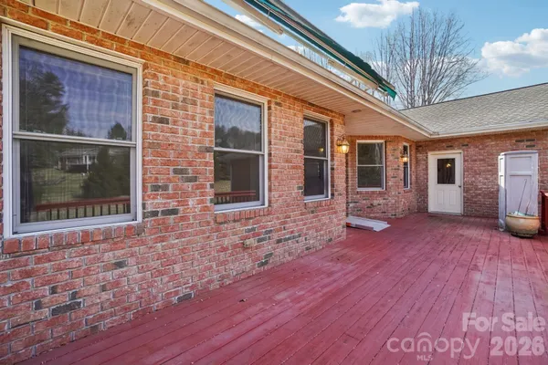 a view of a house with brick walls