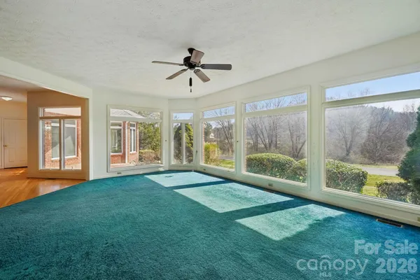 a view of an empty room with windows