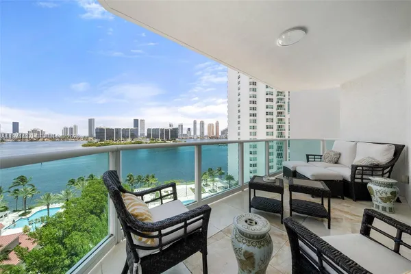 a terrace with outdoor seating and city view
